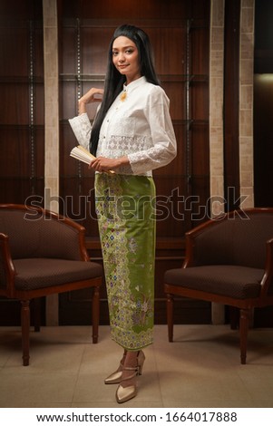 Beautiful lady in Phuket local clothing style.