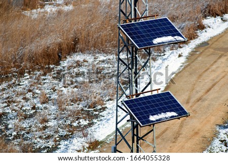 Solar panel under to snow. Ecological image for stock.