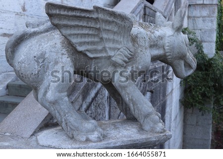 Sculpture of a hellish dog with wings near the building of the Livadia Palace in Crimea. Palace of the reign of Russian Emperor Nicholas II, the city of Yalta.