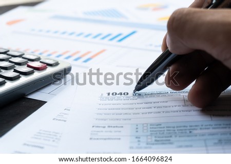 United state 1040 individual tax return form with pen. Tax for govement Royalty-Free Stock Photo #1664096824