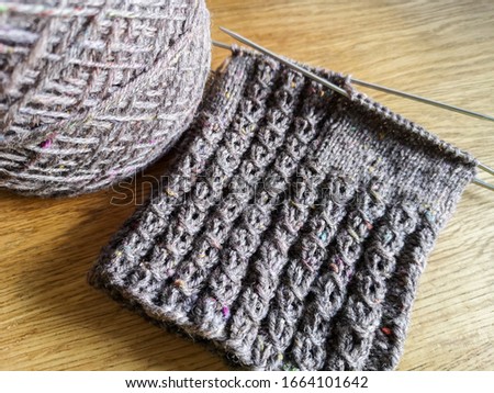 Beautiful handknit socks with handspun, natural sheep wool yarn and an intricate knitting pattern