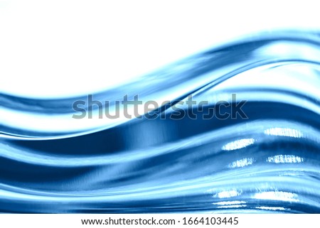 Abstract blurred soft focused futuristic dark blue glass wavy background. 2020 trend color concept