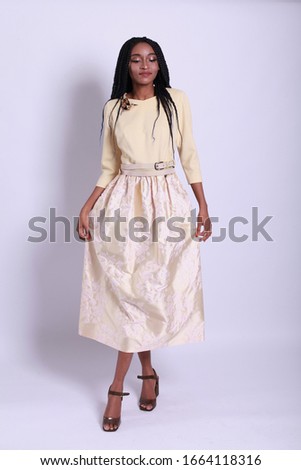 fashion portrait of lovable fascinating delicate alluring gorgeous nice stunning young african teenage. Fashion spring summer photo. Portrait of young smiling beautiful woman in romantic yellow dress

