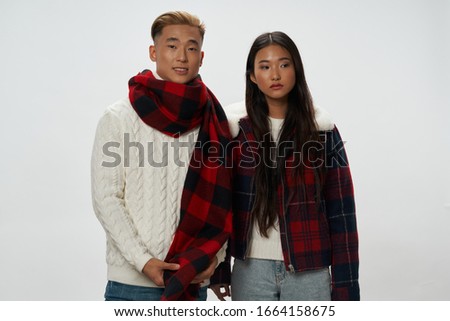 Woman in a jacket isolated background man with a scarf