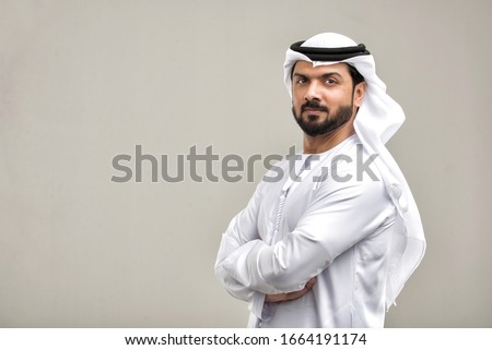 Portrait of arabic man with kandora in a studio Royalty-Free Stock Photo #1664191174