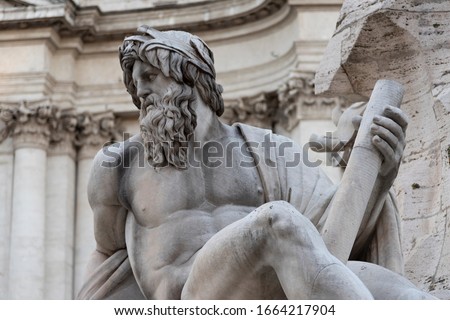 Fountain of the Four Rivers by Gian Lorenzo Bernini, baroque creation located in the center of Piazza Navona, Rome, Italy. Giant white marble statue represents the allegory river Ganges. Royalty-Free Stock Photo #1664217904