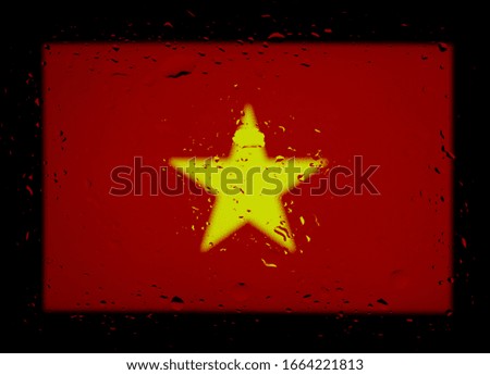 The national flag of Vietnam. Abstract photo with water drops on a black background.