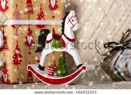 Christmas composition with wooden toy rocking horse 