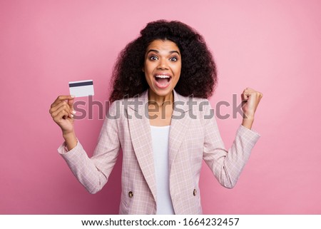 Photo of beautiful crazy dark skin business lady hold plastic wireless credit card save money not use cash currency rich person wear checkered blazer isolated pink pastel color background