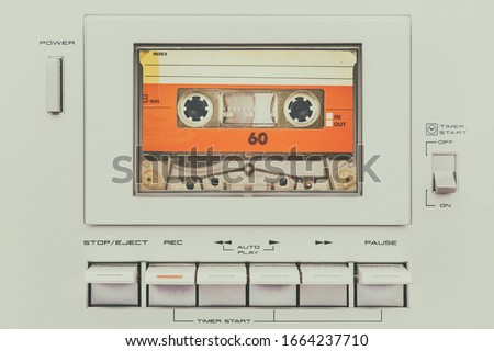 Retro styled image of a vintage silver audio cassette player with buttons Royalty-Free Stock Photo #1664237710