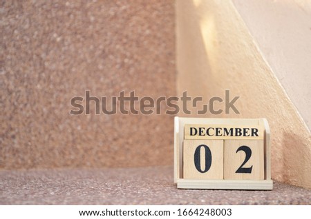 December 2, Empty gravel background with number cube. 