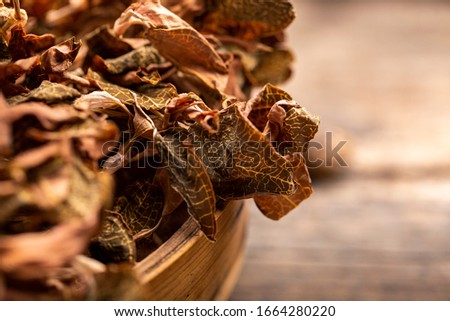 Wild dried Anoectochilus roxburghii in a retro background, Chinese Health Tea, Fujian Specialty, you can drink water, Chinese herbal medicine