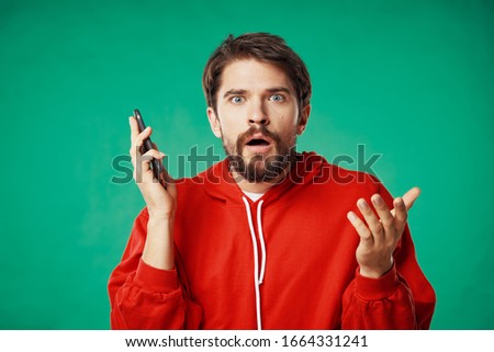 A man with a phone in his hands is an internet technology communication service
