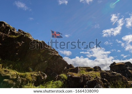 Icelandic Flag at the Mountain Moving by Wind During Sunny Day in Iceland Patriotic Concept in the Nature