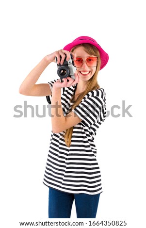 Smiling brunette girl in white striped black dress and red  hat with camera on white backgroundJourney concept.Mock up copy space.