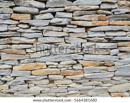 Laying. Wall. Natural stone. Crimean gerbil.	 Royalty-Free Stock Photo #1664381680