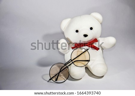 Reading glasses and teddy bear toys