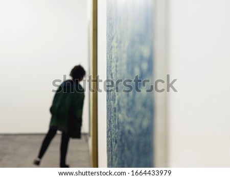 Person inside sitting in  art gallery