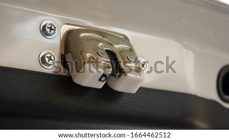 Close up of the car trunk door hinge Royalty-Free Stock Photo #1664462512