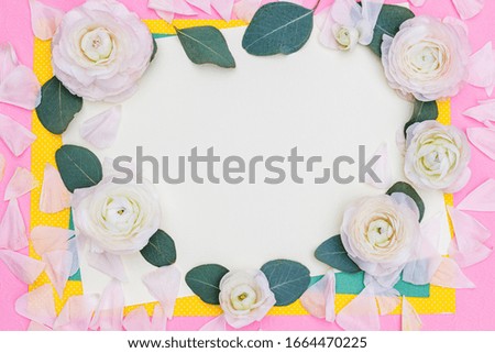 Floral heart frame with Ranunculus Persian buttercup Rosflowers and eucalyptus leaves, flat lay, top view. Greeting card or gift certificate for Valentine’s Day, 8 March, Mother day, Easter or Wedding