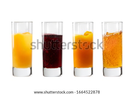 Glasses with orange, cherry, sea buckthorn and apple juices