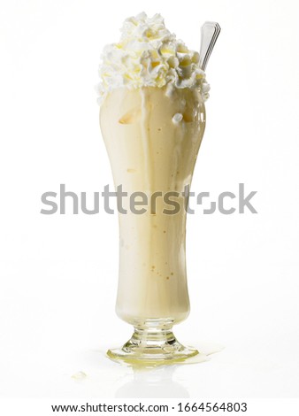 Large vanilla milkshake on white background