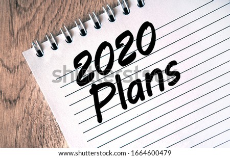 2020 plan your goals. Text on a notebook