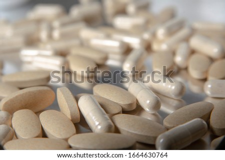 Vitamin C tablets suppliment on table