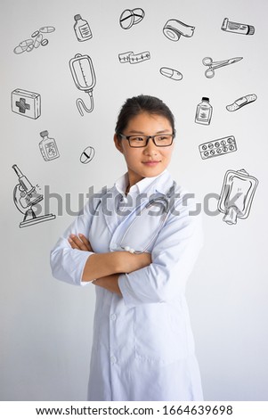 Confident Asian female doctor with hand drawn medical sketches. Medicine concept. Isolated closeup view with medicine icons on background.