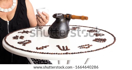 drawing of coffee beans in the form of zodiac signs on a table isolated on a white background. woman drinks coffee. 