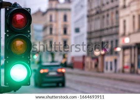 A city crossing with a semaphore. Green light in semaphore - image Royalty-Free Stock Photo #1664693911