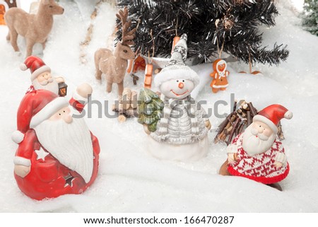 Santa Claus is doing a meeting before Christmas starts. Reindeers, a snowman and some other Santa Clauses are involved.