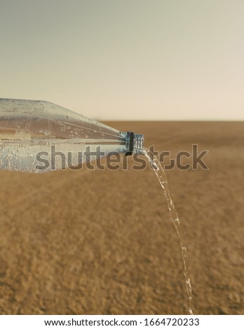 The landscape of the Black Rock Desert in Nevada. An essential element for survival. A bottle of water being poured out. Filtered mineral water.