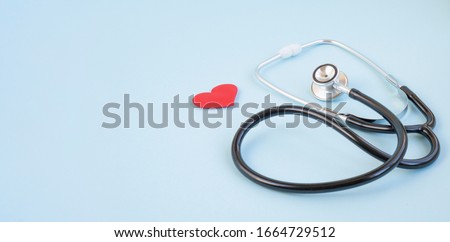 Stethoscope and red heart on a blue background. Greeting background. National doctor's day. Happy nurse 's day. Health day. Top view, a copy of the space. Thank you doctors and nurses . Royalty-Free Stock Photo #1664729512