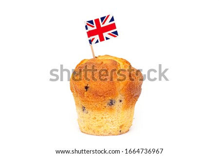 Cupcake with UK flag on toothpick isolated on white background, concept picture