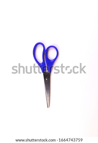 blue scissors on a white background. isolate