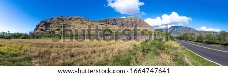 Panoramic view of a road and mountains in Oahu Hawaii
