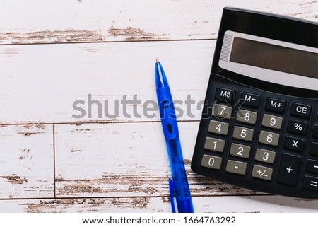black calculator, Business and Finance accounting concept on wooden table