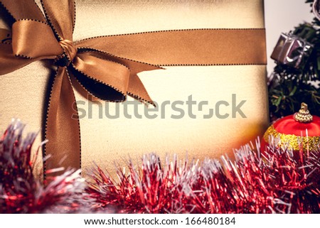 Christmas gift box with golden ribbon