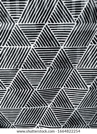 Abstract black and white striped triangles.