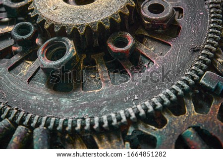 Machine gear, metal cogwheels, nuts and bolts.Selective focus