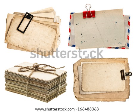 pile of old postcards isolated on white background. vintage paper sheets with clip. air mail envelope. retro design
