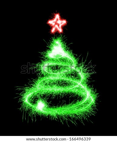 Christmas tree made by sparkler on a black background