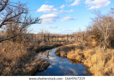 reflection of the sky in creek