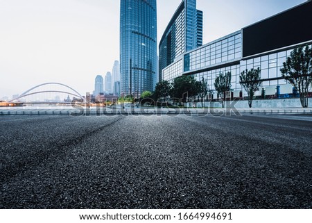Asphalt road High way Empty curved road clouds and sky at sunset Royalty-Free Stock Photo #1664994691