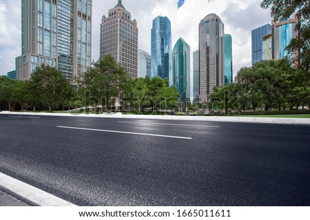 Asphalt road High way Empty curved road clouds and sky at sunset Royalty-Free Stock Photo #1665011611