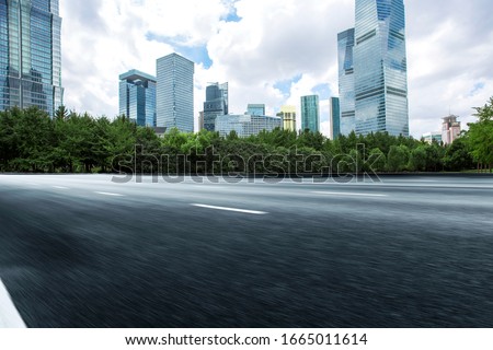 Asphalt road High way Empty curved road clouds and sky at sunset Royalty-Free Stock Photo #1665011614