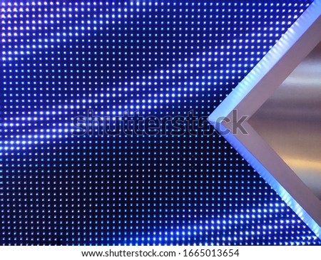 Abstract wall Led  light background. Blue Led light with metallic decoration.