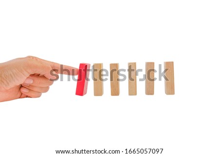 Hand and falling pieces of wodden blocks on white background with clipping path