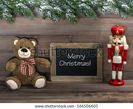 nostalgic christmas decoration with antique toys and blackboard with sample text Merry Christmas! retro style dark picture